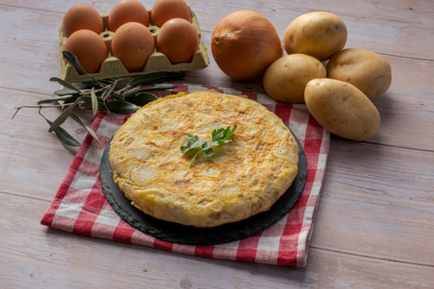 istock Traditional spanish omelette on wooden table 1298576668