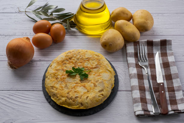 istock Traditional spanish omelette on wooden table 1298576675