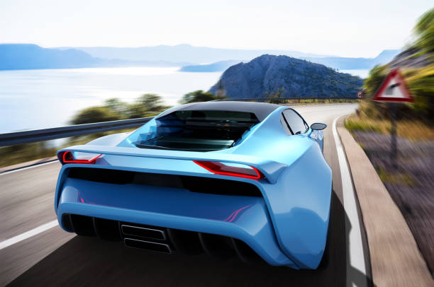 istock blue sportscar driving on a seaside road 1298578890