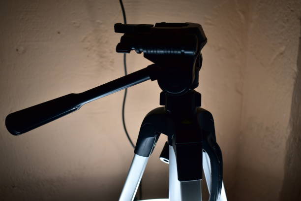 istock fragment of a camera tripod in contrasting light 1298578998
