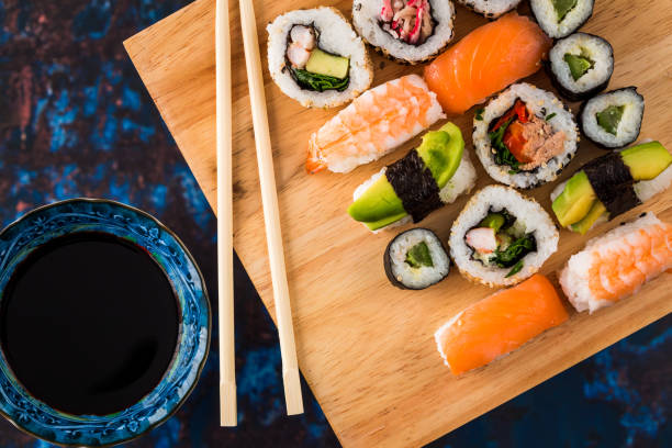 istock Fresh sushi selection on wooden board 1298584767
