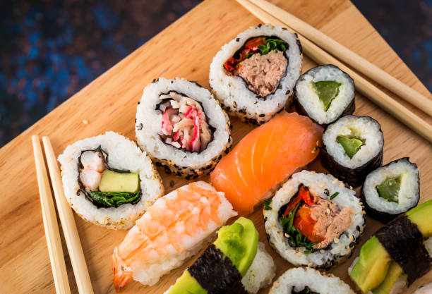 istock Fresh sushi selection on wooden board 1298584800