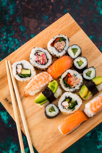 istock Fresh sushi selection on wooden board 1298584817