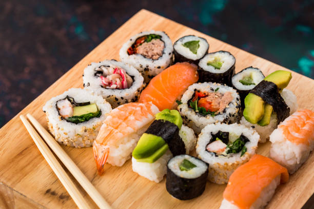 istock Fresh sushi selection on wooden board 1298584858