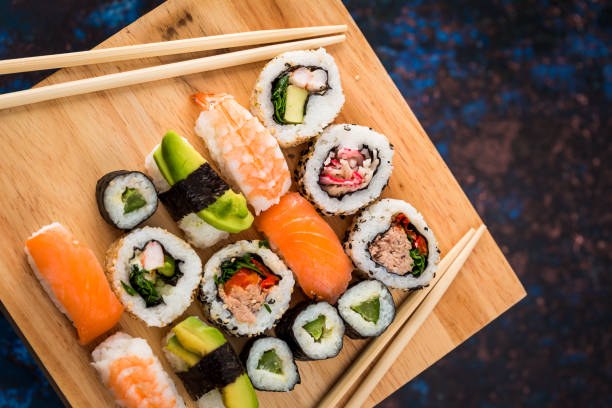 istock Fresh sushi selection on wooden board 1298584861