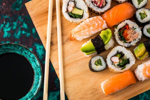 istock Fresh sushi selection on wooden board 1298585430