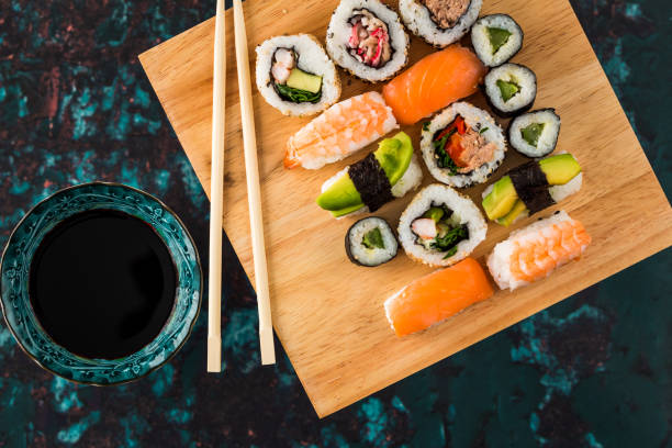 istock Fresh sushi selection on wooden board 1298585472