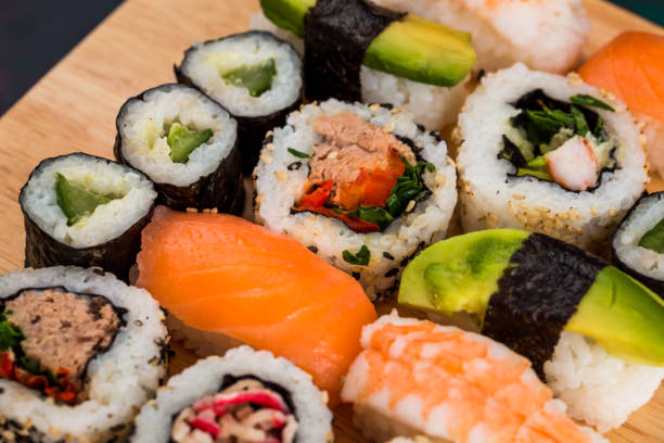 istock Fresh sushi selection on wooden board 1298585483