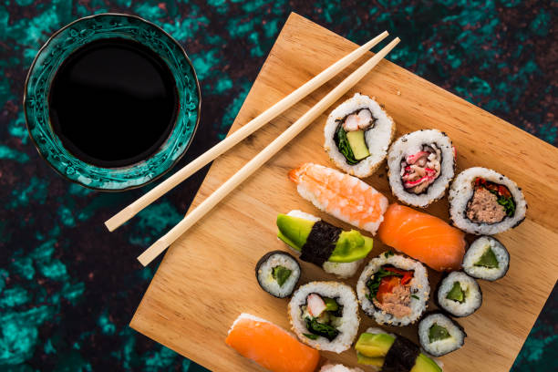istock Fresh sushi selection on wooden board 1298585622