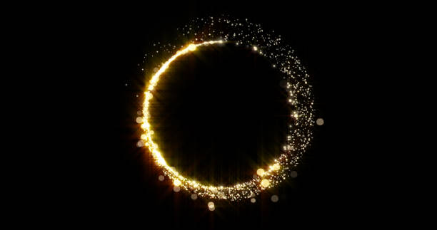 istock Gold glitter circle trail with glittering golden light. Glister shiny sparks ring with particles and bokeh glisten magic glow on black background 1298585922