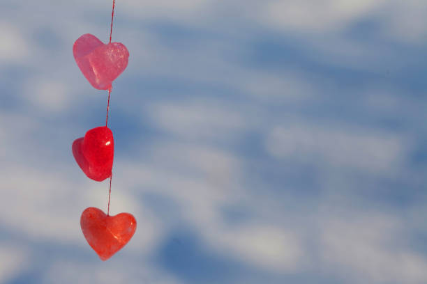 istock valentine's day card, multicolored ice hearts in sunlight 1298588976