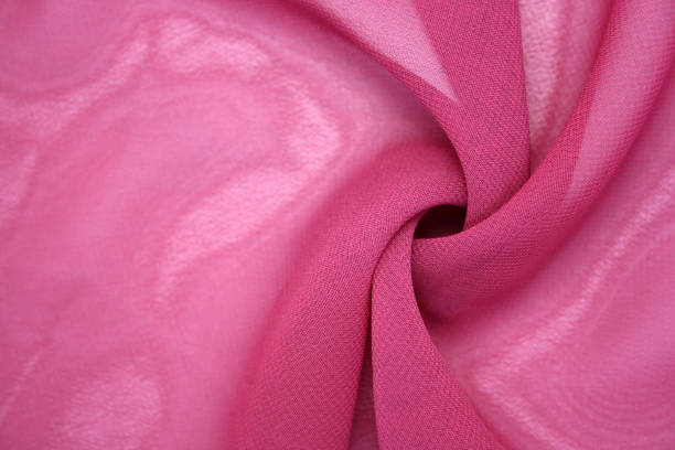 istock The background is made of synthetic fabric lying in waves. 1298597618