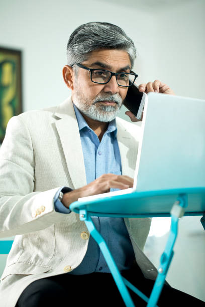 istock Businessman talking on mobile phone 1298605319