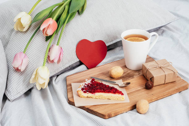 istock Valentine's Day. Breakfast in bed, flowers and a gift 1298605873