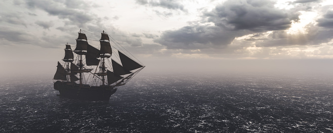 Pirate ship sailing on the ocean. Stormy clouds. Vintage cruise