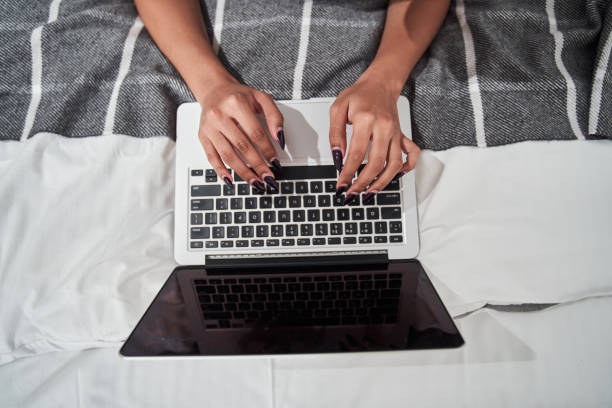 istock Woman typing at the laptop keyboard while chatting 1298606390
