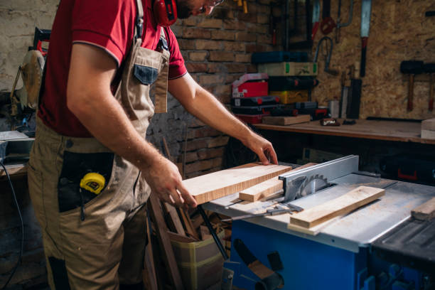 istock Anonymous Carpenter Working on a Piece of Furniture in his Workshop 1298607104