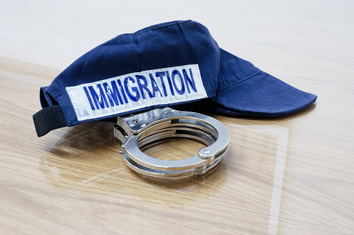 Identification cap and handcuffs of immigration service. Israel.
