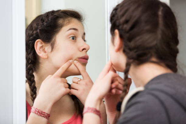 istock Girl cleaning pores 1298608094
