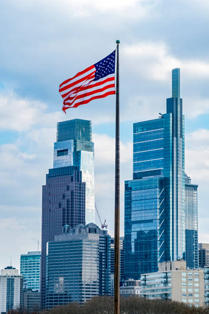 istock US Flag flying with Philadelphia PA skyline 1298609415