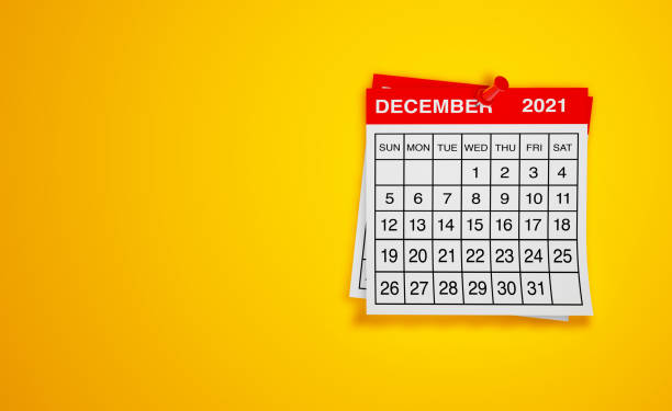 istock December 2021 calendar on yellow background 1298616551
