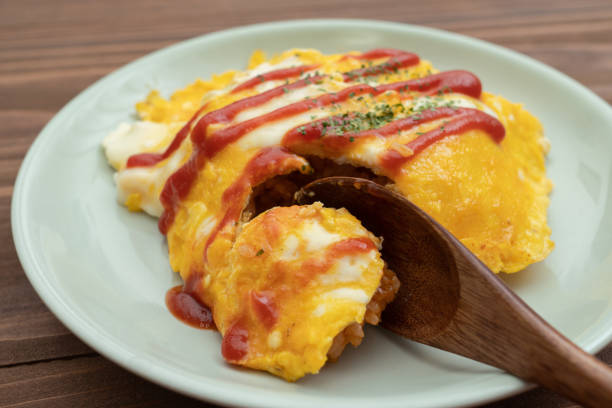 Omlette rice half eaten, eating lifestyle