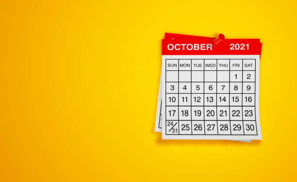 istock October 2021 calendar on yellow background 1298616939
