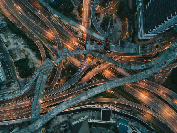 istock drone view directly above night scene city with elevated road bridges cross junction 1298618205