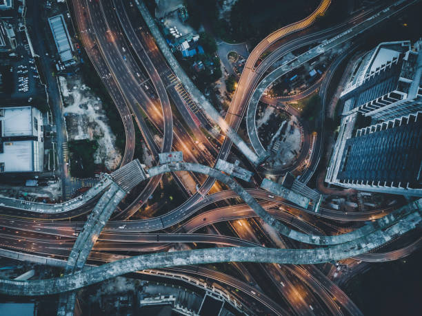 istock drone view directly above night scene city with elevated road bridges cross junction 1298618215
