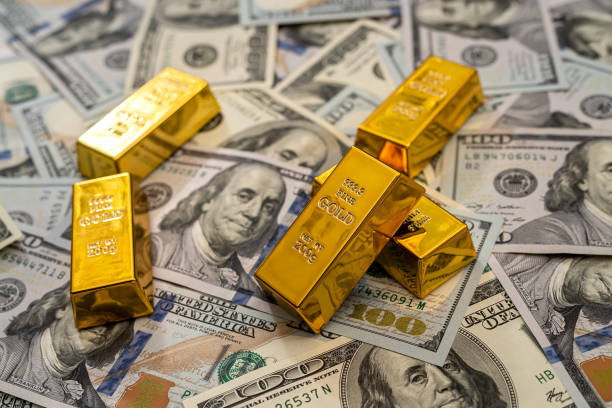 istock finance concept dollar bills and gold bar 1298621700