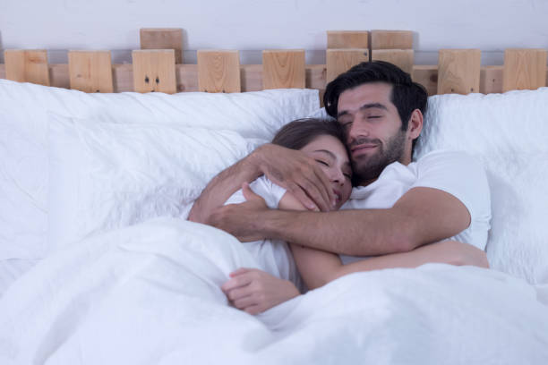 istock Funny couple in bed 1298623553