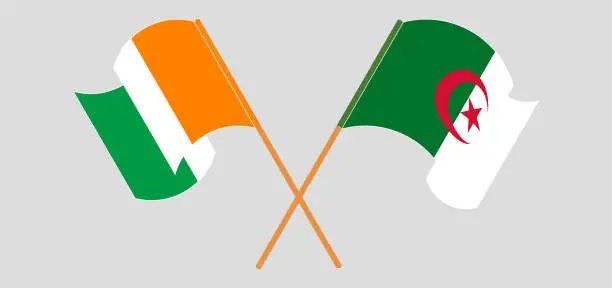 Vector illustration of Crossed and waving flags of Republic of Ivory Coast and Algeria
