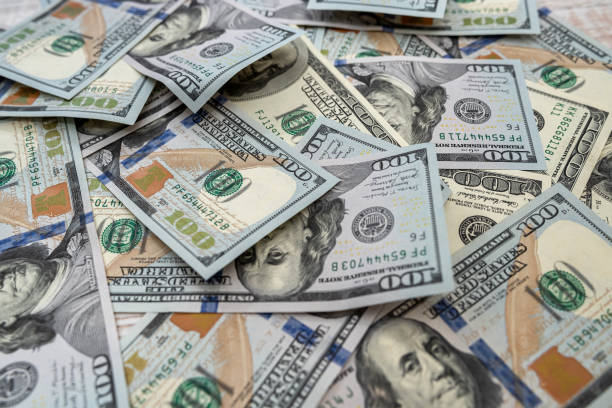istock lot of american dollars as background 1298624329