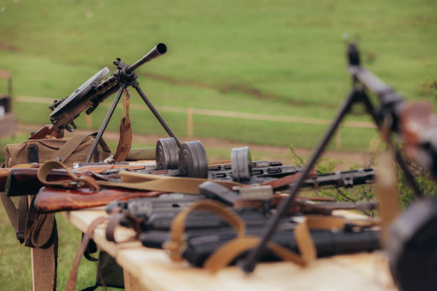 istock Two Diagterev submachine guns stand opposite each other on a table during the reconstruction 1298624521