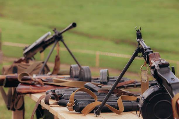 istock Two Diagterev submachine guns stand opposite each other on a table during the reconstruction of World War II 1298624525