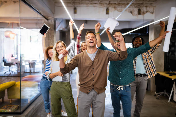 istock Successful company with happy employees in modern office 1298627005