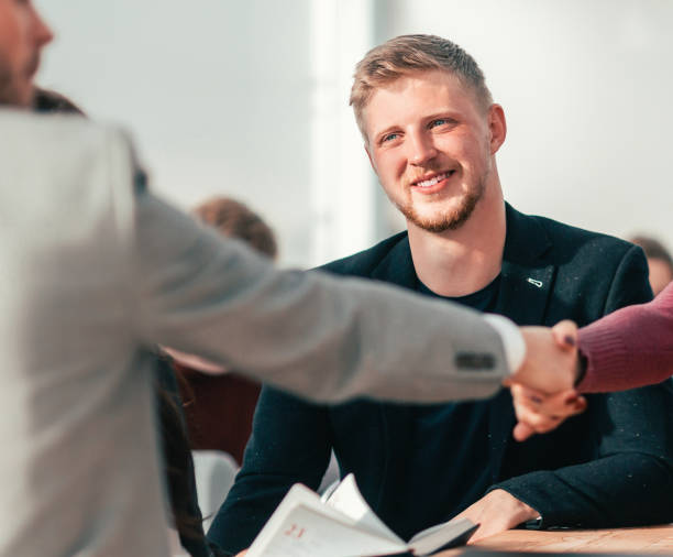 istock lucky applicant shaking hands with the employer during the interview 1298629144