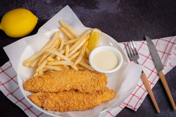 Fish and Chips with French fries and dipping sauce