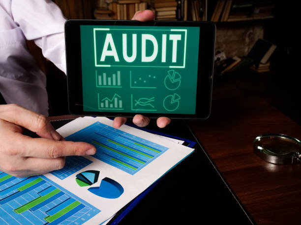 istock Auditor shows audit results at the tablet. 1298629621