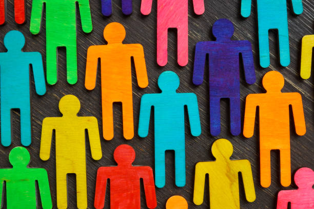 Figures with different colors as symbol of inclusion and diversity. Figures with different colors as symbol of inclusion and diversity. social inclusion stock pictures, royalty-free photos & images