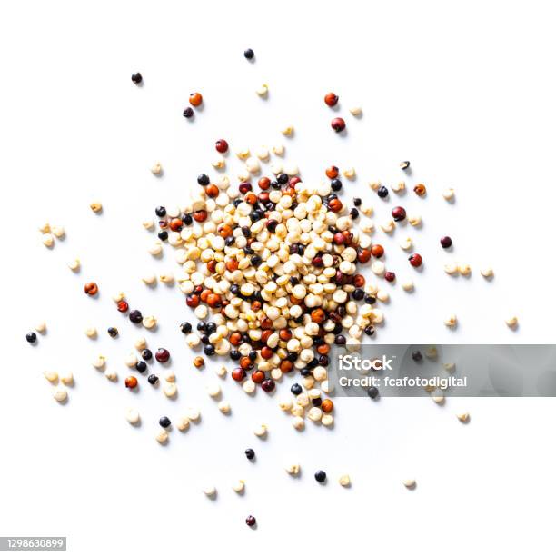 Mix Of Black Red And White Quinoa Seeds Spilled On White Background Overhead View Stock Photo - Download Image Now