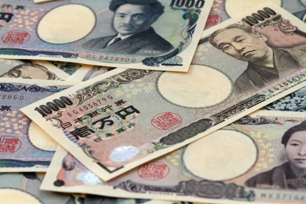 istock Japanese paper money background 1298631968