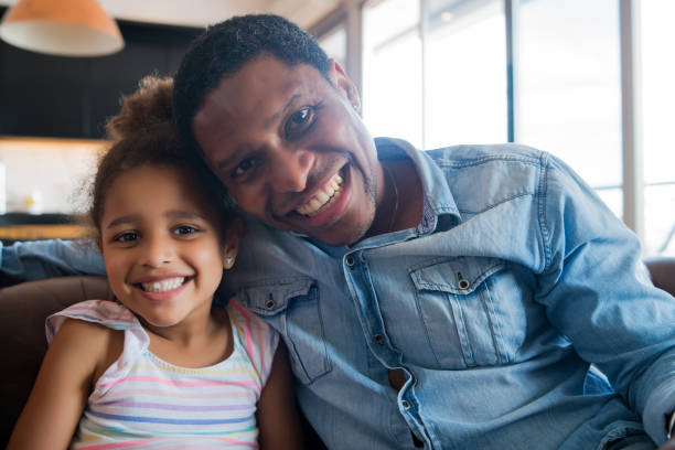 istock Daughter and father at home. 1298633008