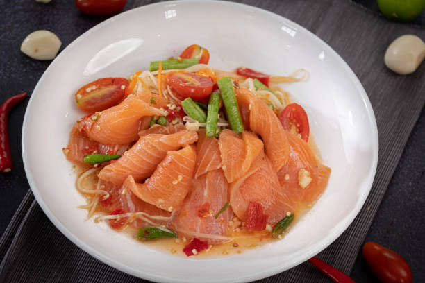 istock Papaya salmon spicy salad Thai style 1298633394