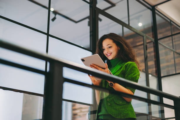 Businesswoman using digital tablet in the office