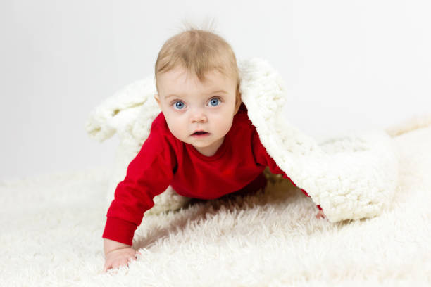 istock A small child is covered by a large white blanket 1298637342