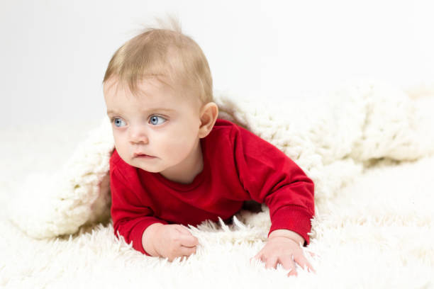 istock A small child is covered by a large white blanket 1298637350