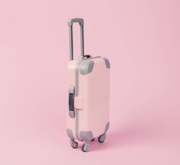 istock Pink suitcase on a pink background. Selective focus. Travel concept. 1298638409