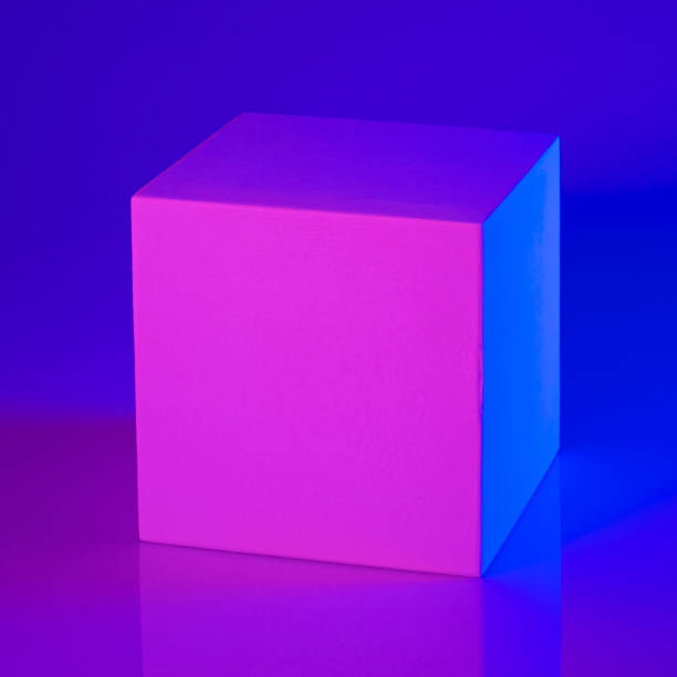istock Gypsum cube in pink and blue neon light 1298641266