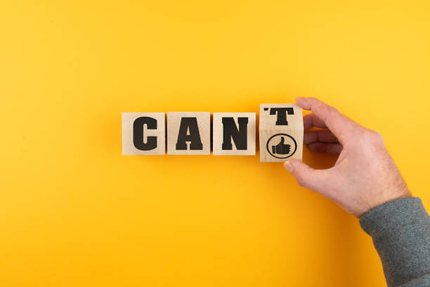 istock hand changing CAN'T to CAN on wooden blocks 1298641863